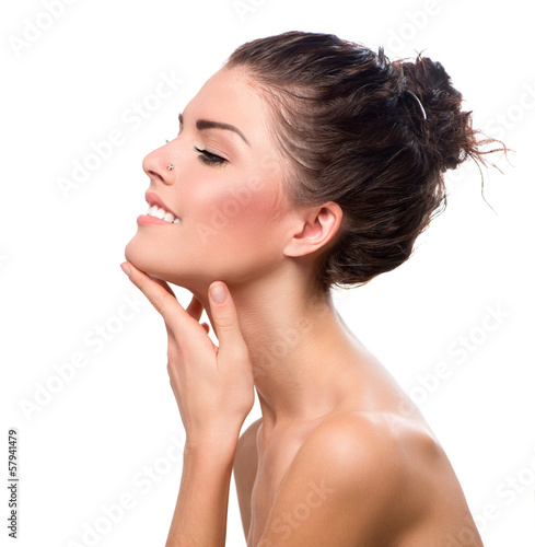 Photo: Beauty Portrait. Beautiful Spa Girl Touching her Face Beauty Portrait. Beautiful Spa Girl Touching her Face