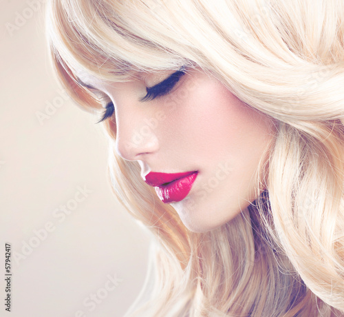 Photo: Beautiful Blond Girl with Healthy Long Wavy Hair. White Hair Beautiful Blond Girl with Healthy Long Wavy Hair. White Hair