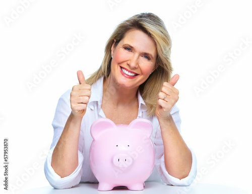 Photo: Elderly woman with piggy bank. Elderly woman with piggy bank.