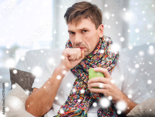 Photo: ill man with flu at home ill man with flu at home