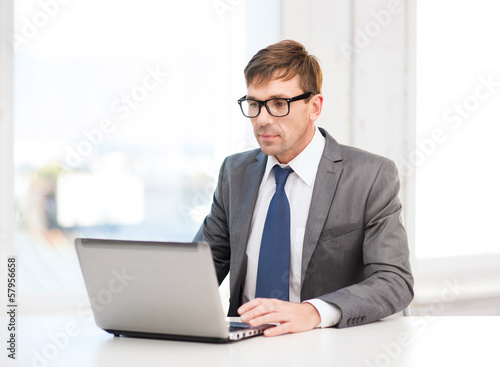 Photo: businessman working with laptop computer businessman working with laptop computer