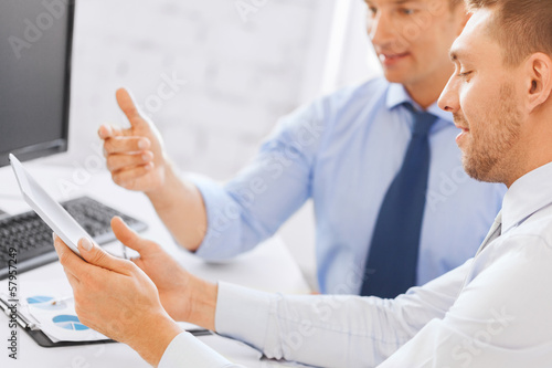Photo: businessmen with notebook and tablet pc businessmen with notebook and tablet pc