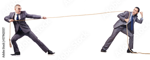 Photo: Man in tug of war concept on white Man in tug of war concept on white