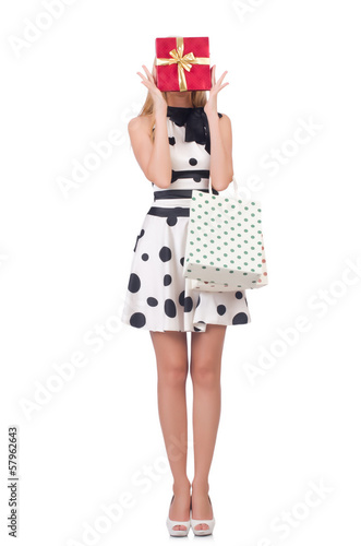 Photo: Young woman with christmas shopping on white Young woman with christmas shopping on white
