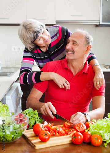 Photo: married mature couple cooking together married mature couple cooking together