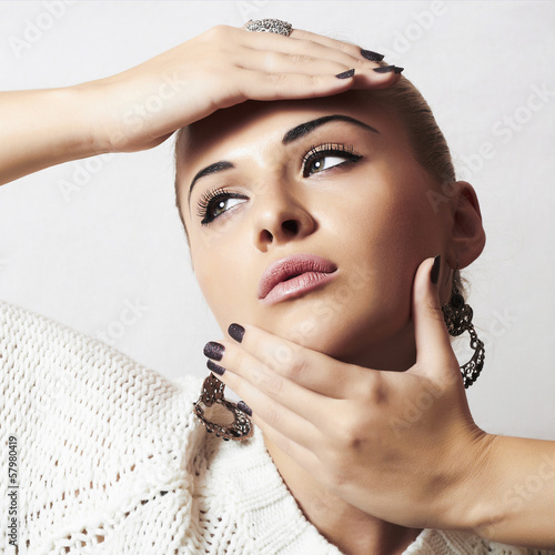 Photo: Beautiful woman.Jewelry and Beauty.manicure.hairless girl Beautiful woman.Jewelry and Beauty.manicure.hairless girl