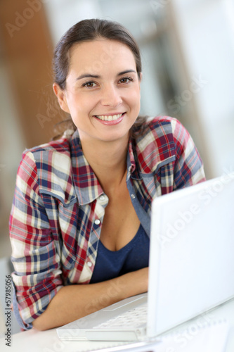 Photo: Cheerful young woman at university Cheerful young woman at university