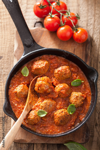 Photo: meatballs with tomato sauce in black pan meatballs with tomato sauce in black pan