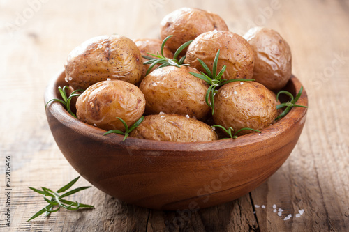 Photo: baked potatoes in wooden bowl baked potatoes in wooden bowl