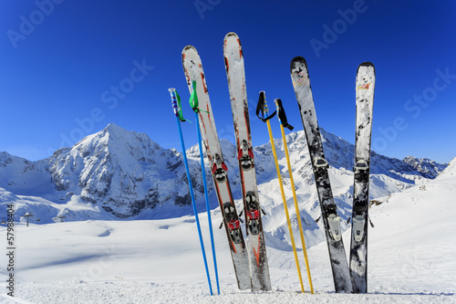 Photo: Ski, winter season - ski equipments on ski run Ski, winter season - ski equipments on ski run