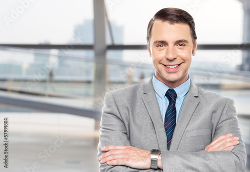 Photo: Handsome confident business executive Handsome confident business executive