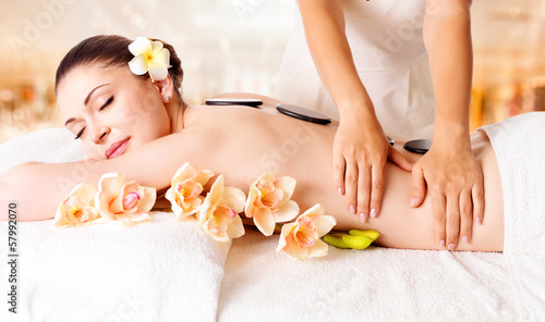 Photo: Woman having massage of body in spa salon Woman having massage of body in spa salon
