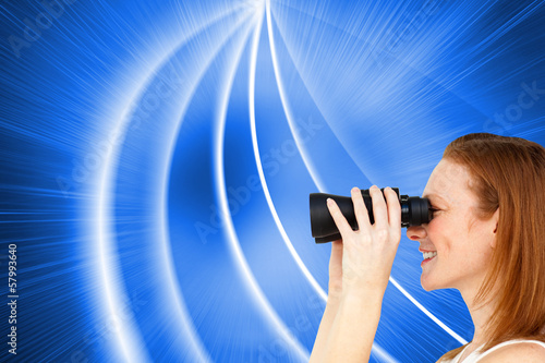 Photo: Composite image of charismatic businesswoman predicting future s Composite image of charismatic businesswoman predicting future s