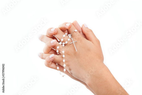 Photo: Praying hands with a rosary Praying hands with a rosary