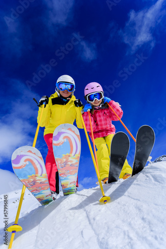 Photo: Ski and fun - skiers enjoying ski holiday Ski and fun - skiers enjoying ski holiday