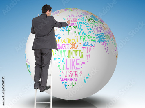 Photo: Composite image of businessman standing on ladder Composite image of businessman standing on ladder
