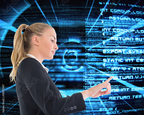 Photo: Composite image of businesswoman pointing somewhere Composite image of businesswoman pointing somewhere