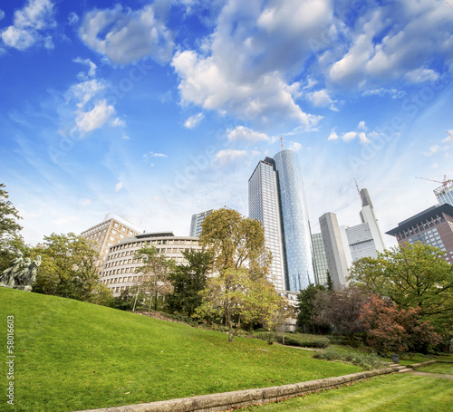 Photo: Frankfurt, Germany. Beautiful park with modern city skyline on a Frankfurt, Germany. Beautiful park with modern city skyline on a
