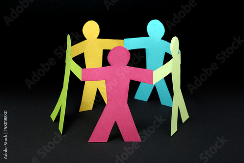 Photo: Circle of colorful paper people on black background Circle of colorful paper people on black background