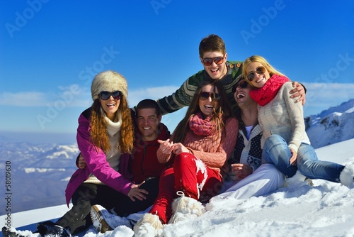 Photo: friends have fun at winter on fresh snow friends have fun at winter on fresh snow