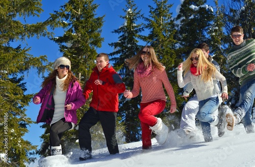 Photo: friends have fun at winter on fresh snow friends have fun at winter on fresh snow