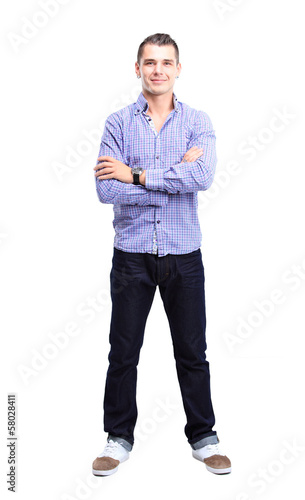 Photo: Full length portrait of a stylish young man with arms crossed Full length portrait of a stylish young man with arms crossed