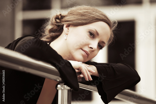 Photo: Sad beautiful woman daydreaming Sad beautiful woman daydreaming