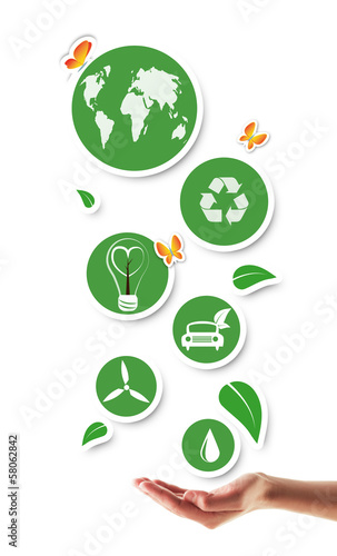Photo: Hand holding green ecological icons Hand holding green ecological icons