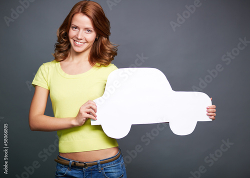 Photo: Girl with paper car Girl with paper car