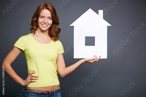 Photo: Girl with paper house Girl with paper house