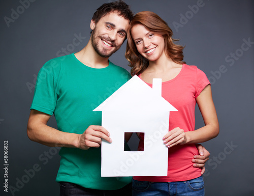 Photo: Couple with paper house Couple with paper house