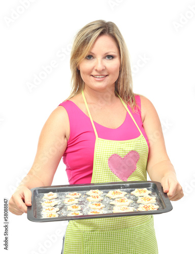Photo: Woman holding tray with raw cookies isolated on white Woman holding tray with raw cookies isolated on white