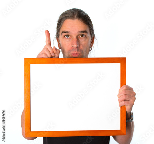 Photo: man with white signboard is showing the forefinger man with white signboard is showing the forefinger