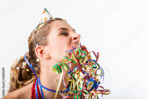 Photo: Woman at boring birthday party with streamer Woman at boring birthday party with streamer