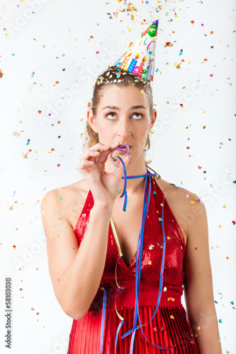 Photo: Woman at boring birthday party with streamer Woman at boring birthday party with streamer