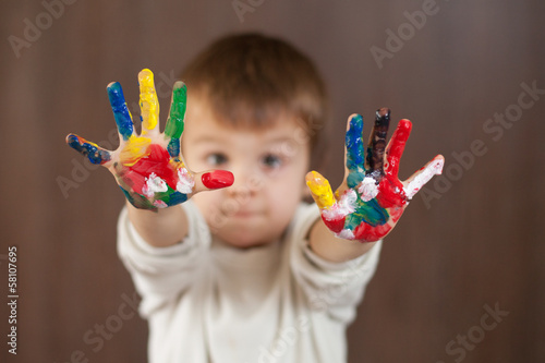 Photo: Boy with painted hands Boy with painted hands