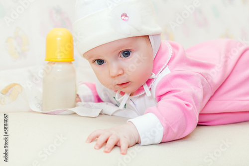 Photo: Little baby with bottle of milk Little baby with bottle of milk