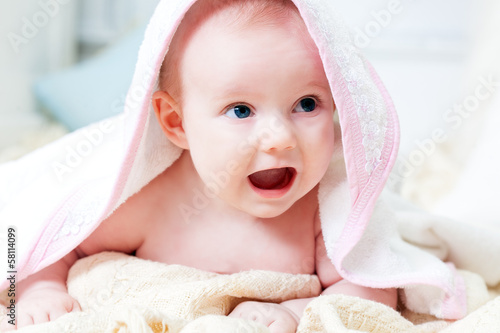 Photo: Little baby under rose towel Little baby under rose towel