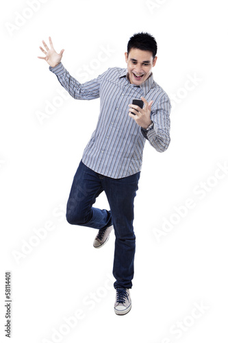 Photo: Happy asian man with mobile phone Happy asian man with mobile phone