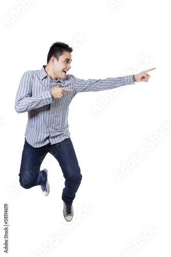 Photo: Happy man pointing something Happy man pointing something