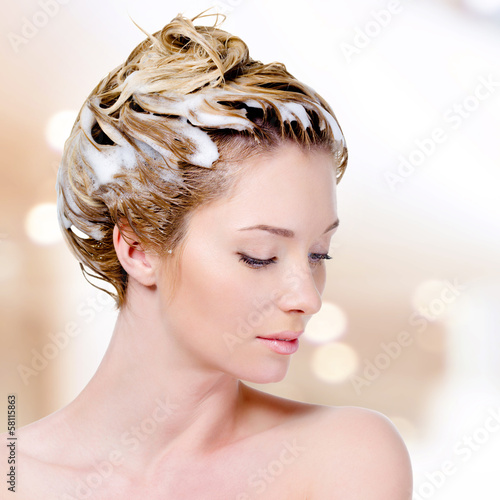 Photo: Woman with soaping head and closed eyes Woman with soaping head and closed eyes