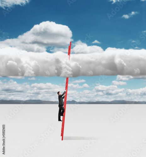 Photo: young businessman climbing young businessman climbing