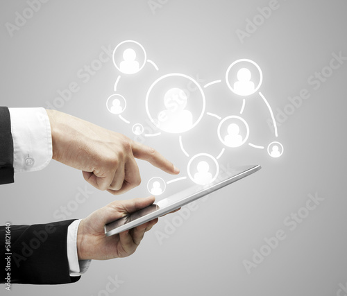 Photo: hands holding tablet hands holding tablet