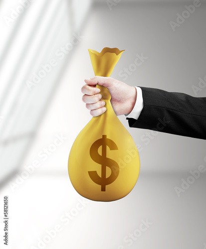 Photo: hand handing money pack hand handing money pack