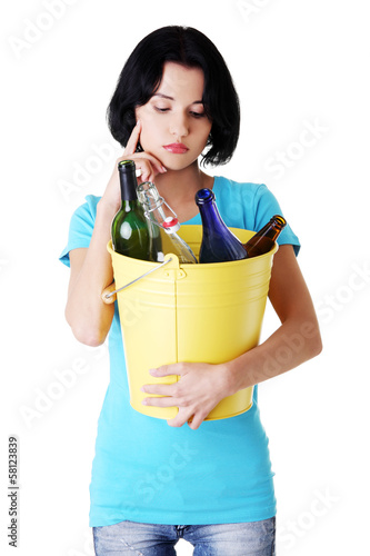 Photo: Attractive woman with bottles, recycling idea. Attractive woman with bottles, recycling idea.