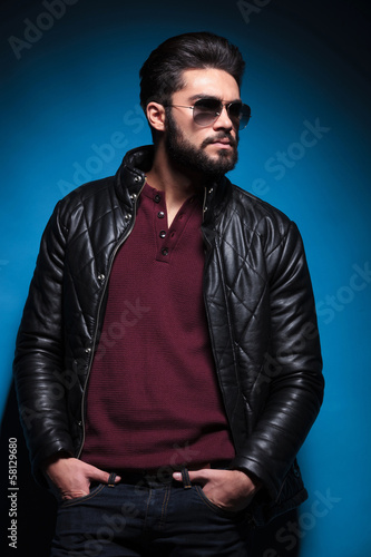 Photo: side view profile of a young bearded fashion man in leather jack side view profile of a young bearded fashion man in leather jack