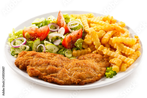 Photo: Pork chop, French fries and vegetables Pork chop, French fries and vegetables