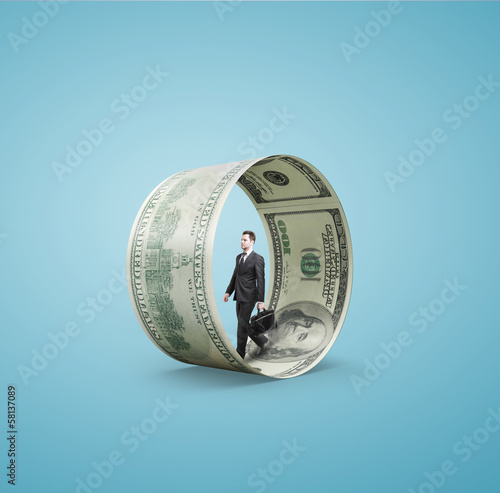 Photo: man walking in money wheel man walking in money wheel