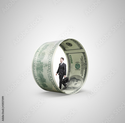 Photo: man walking in money wheel man walking in money wheel