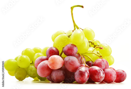 Photo: Bunch of fresh grapes isolated on white Bunch of fresh grapes isolated on white